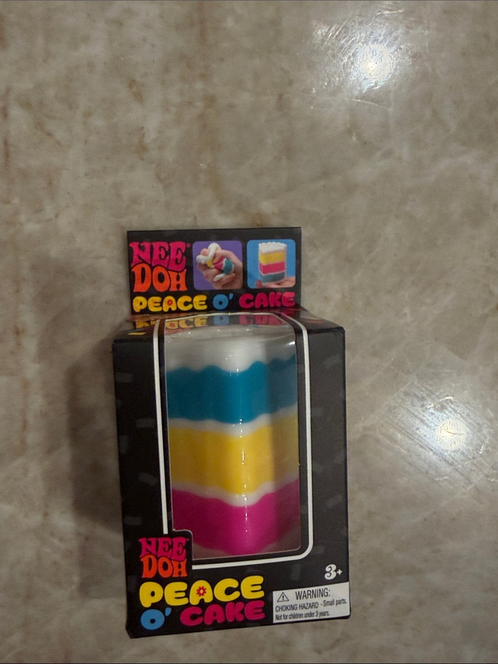 NeeDoh Peace O' Cake Layered Stress Toy - White, Blue, Yellow, Pink